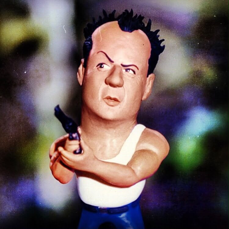 Escultura caricatura de Bruce Willis